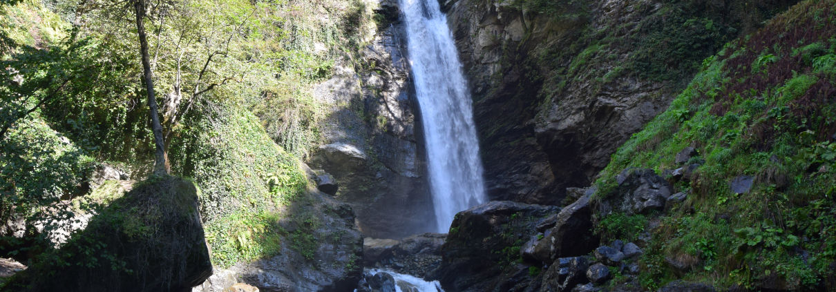 View of the impressive Ninoskhevi waterfall in the forest of Georgia