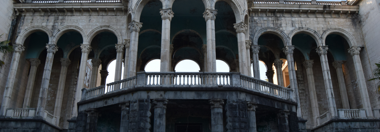 Impressive abandoned building in Tskaltubo with colonnades and arches